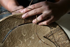 Close up of a maker hand creating a handcrafted product using traditional skills